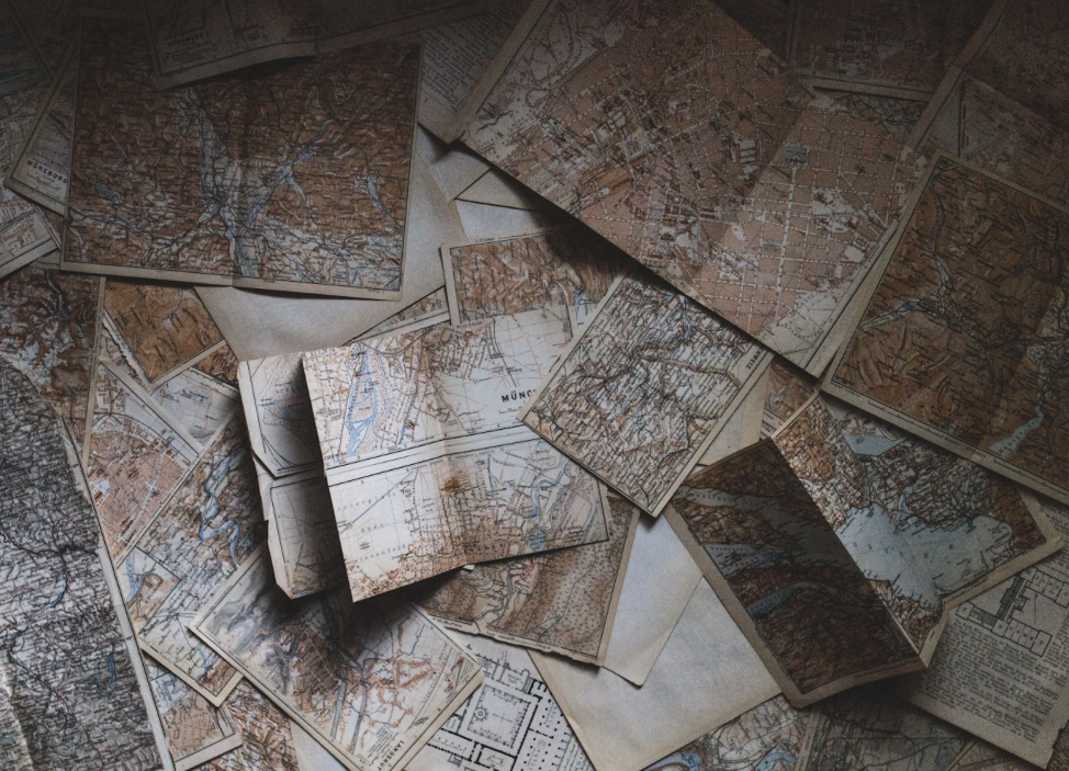a pile of maps on a table
